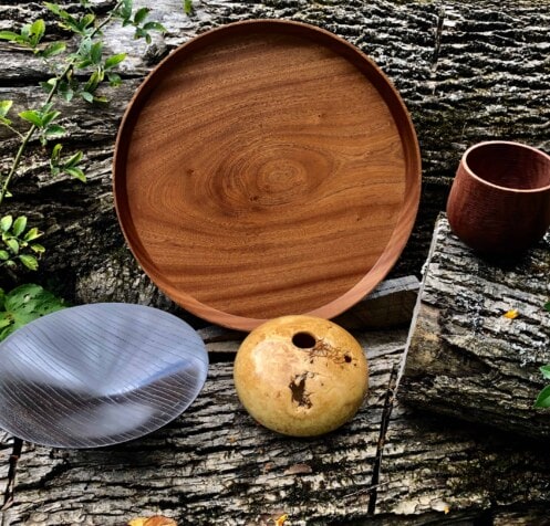 Four wooden bowls shown from above.